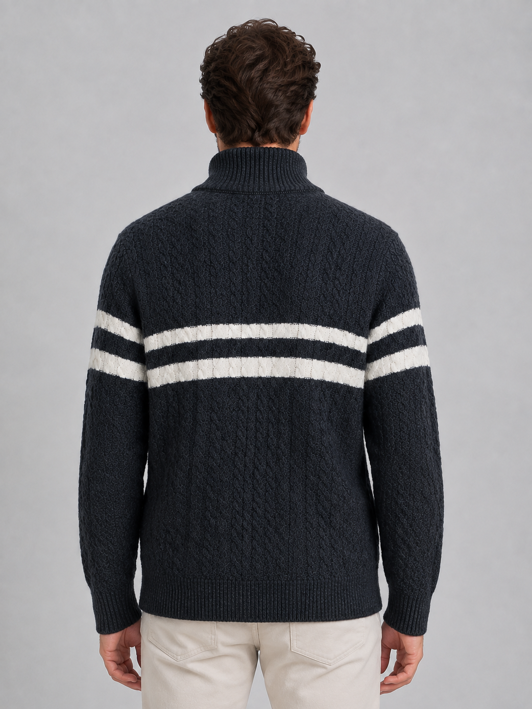 Men's dark charcoal wool cable knit jumper with cream horizontal stripes across chest, viewed from back