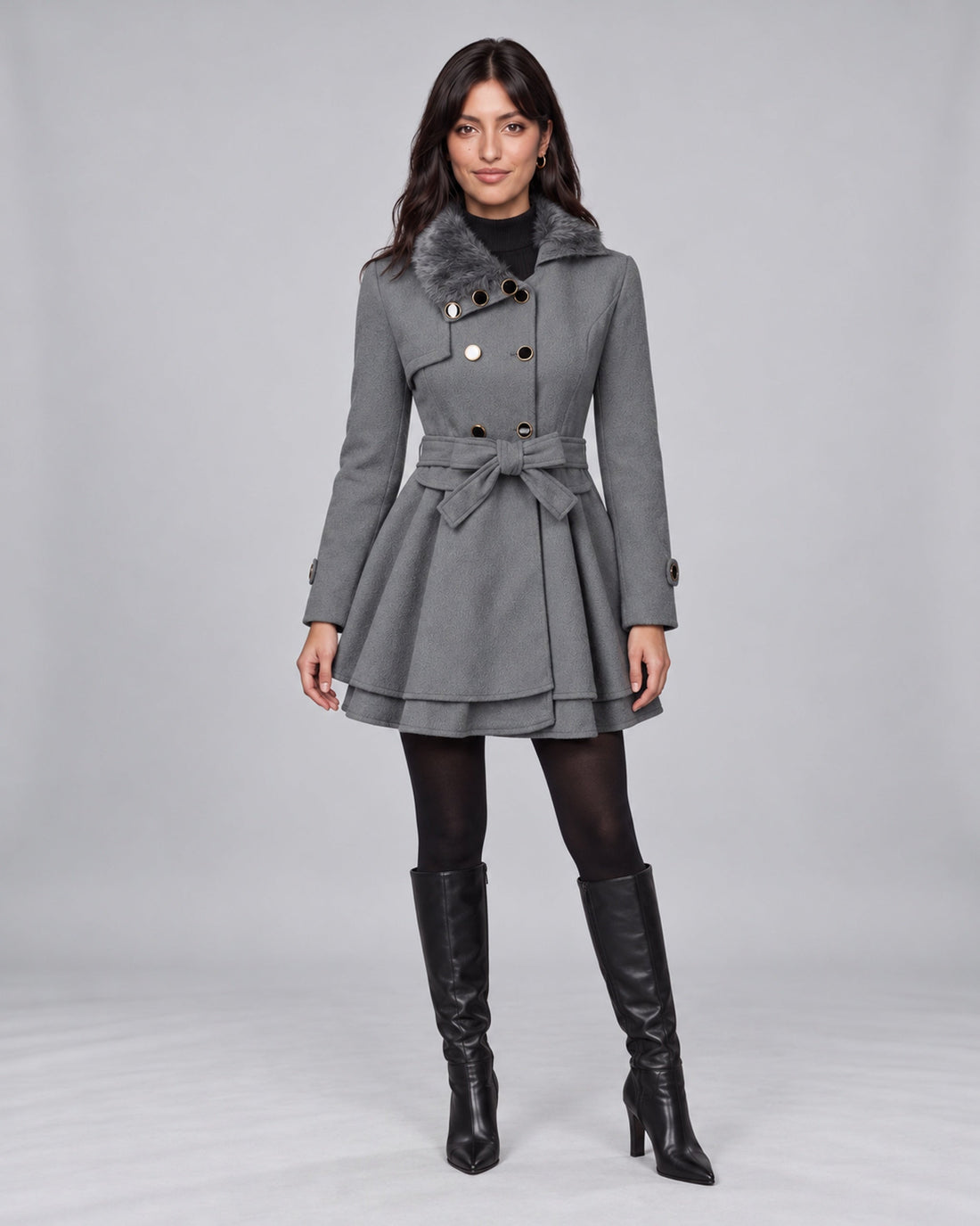 Jasmine wearing claudia grey trench coat on the Urban Devyne saved studio backdrop