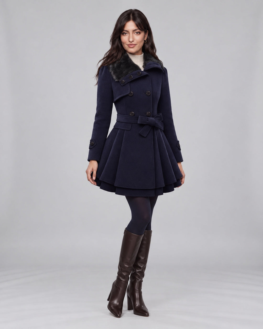 Jasmine wearing claudia blue trench coat on the Urban Devyne saved studio backdrop