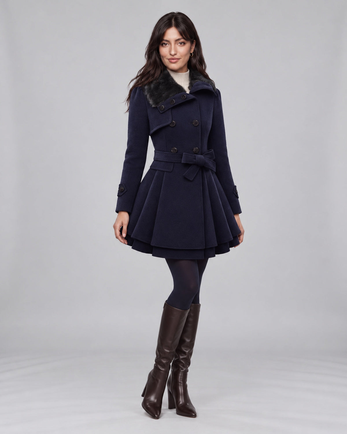 Jasmine wearing claudia blue trench coat on the Urban Devyne saved studio backdrop