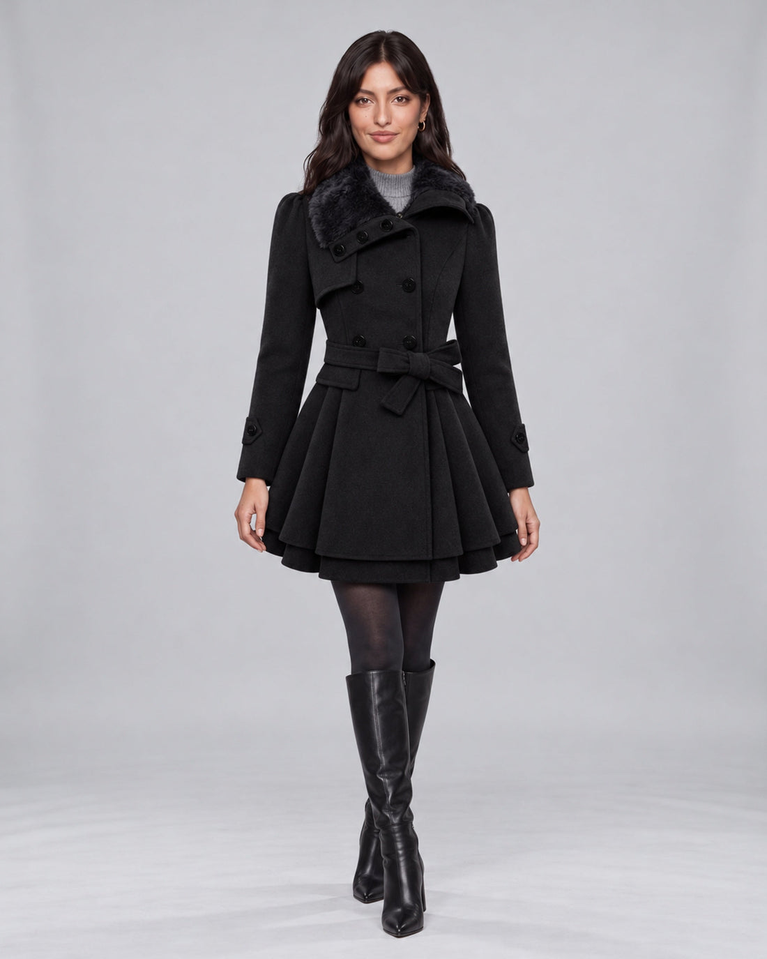 Jasmine wearing claudia black trench coat on the Urban Devyne saved studio backdrop