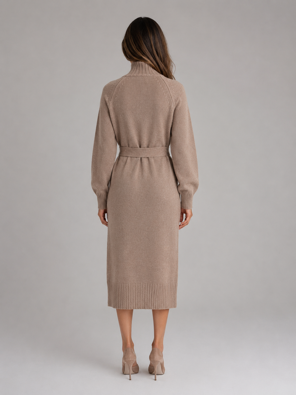 Woman wearing beige roll neck belted midi jumper dress with long sleeves, shown from back view