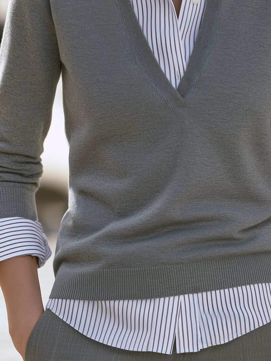 Gray V-neck knit sweater with white striped shirt collar and cuff details, layered faux two-piece design