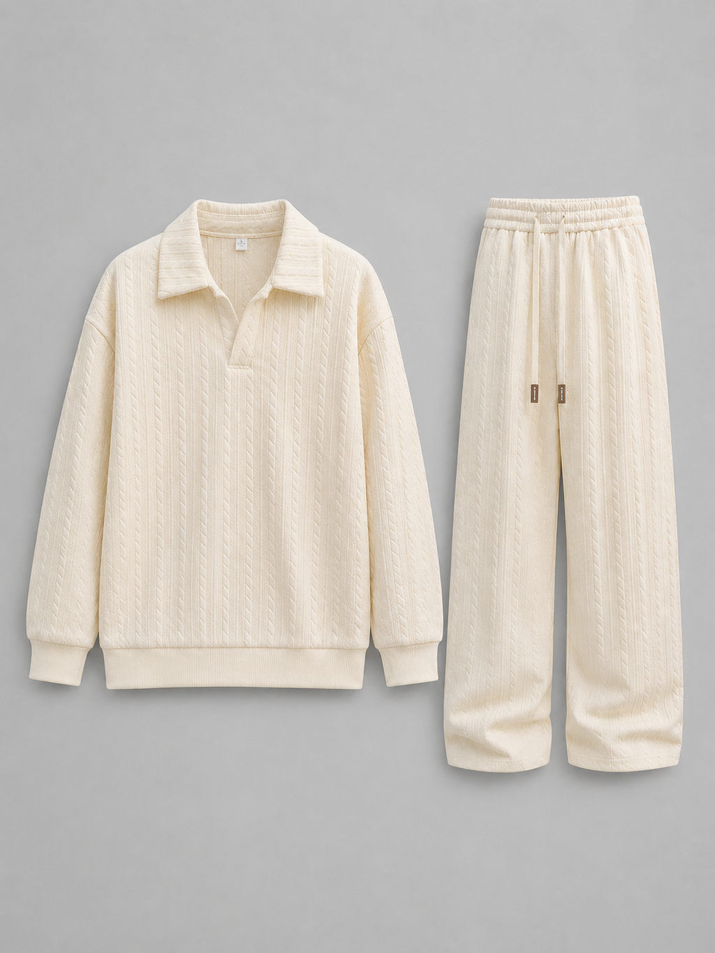 Cream cable knit collared sweatshirt and wide-leg trousers two-piece set displayed on gray background