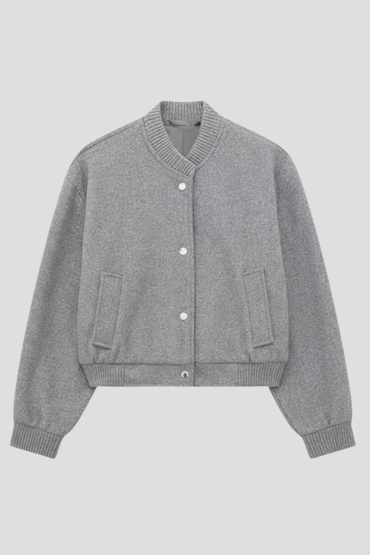 Gray cropped jacket with snap buttons, ribbed collar and cuffs, two front pockets, displayed on neutral background