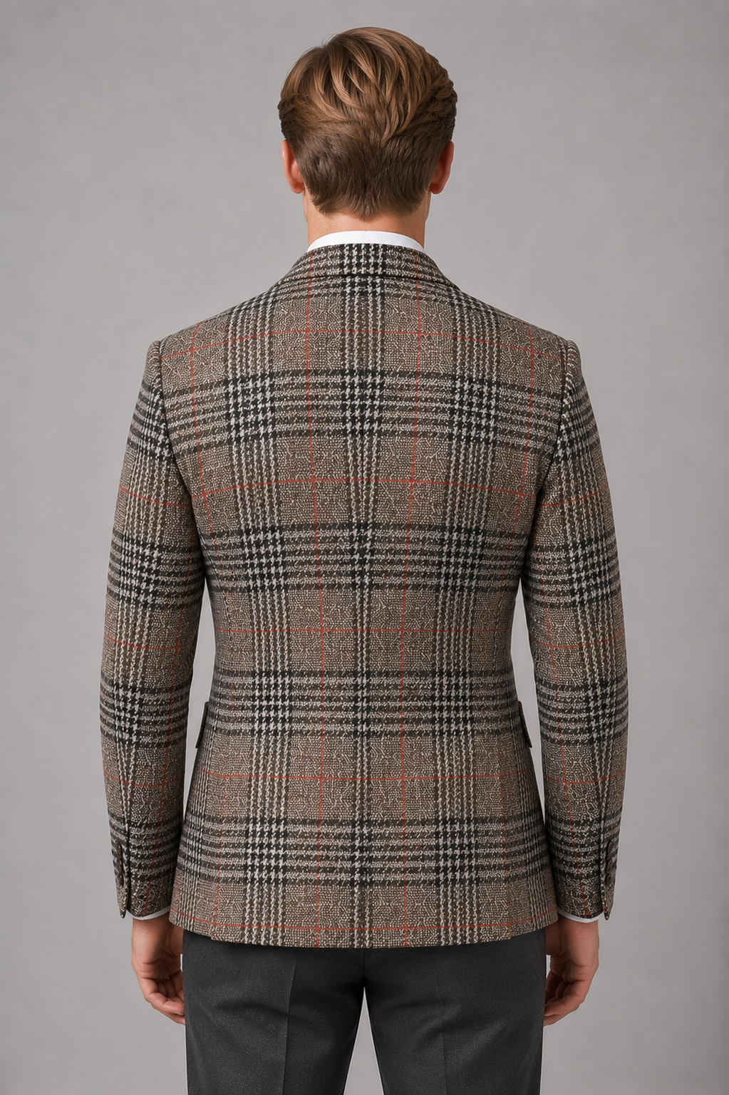 Back view of men's tailored tweed blazer jacket with grey, black and red plaid pattern, white collar visible