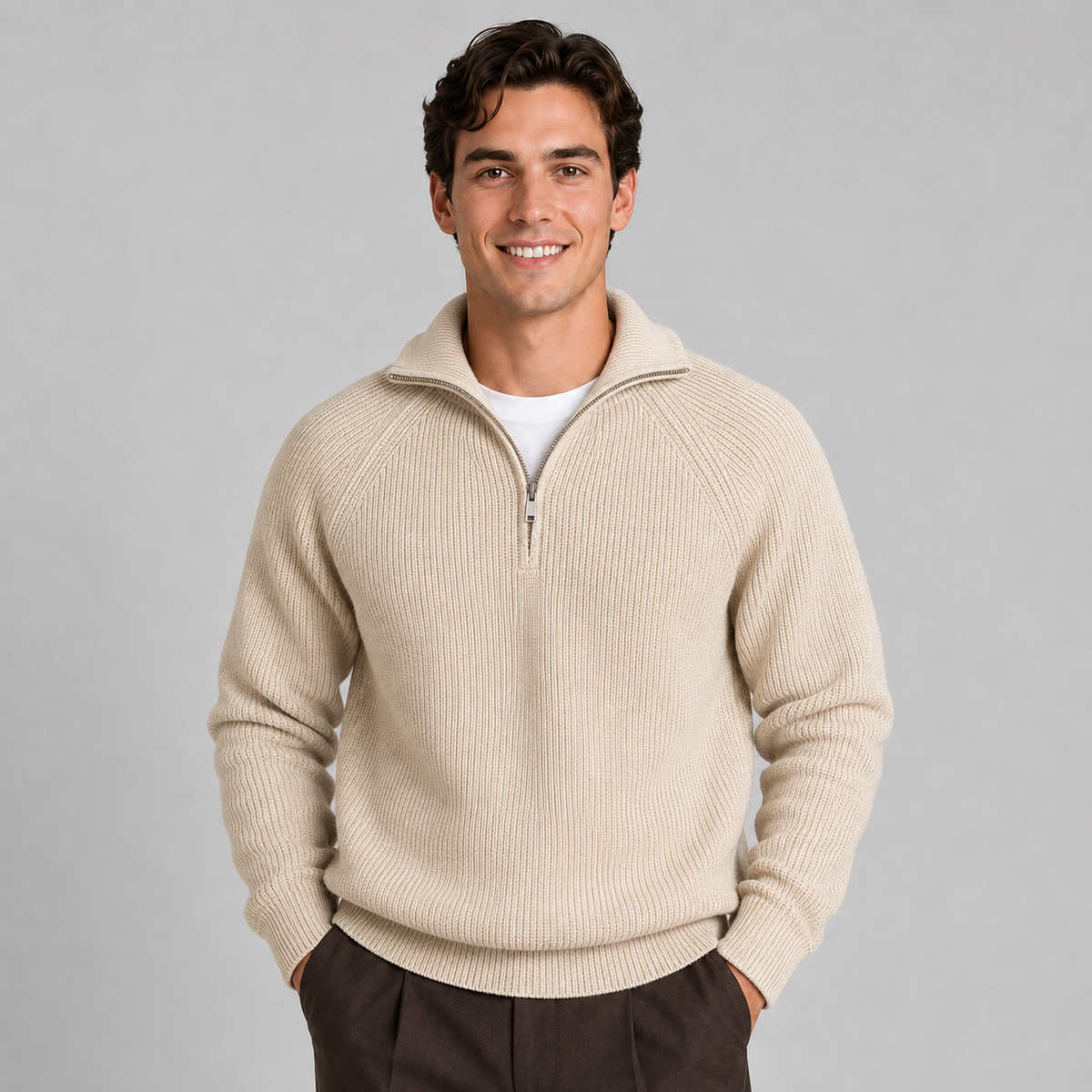 Man wearing beige ribbed quarter-zip knitted sweater with white undershirt and dark brown pants
