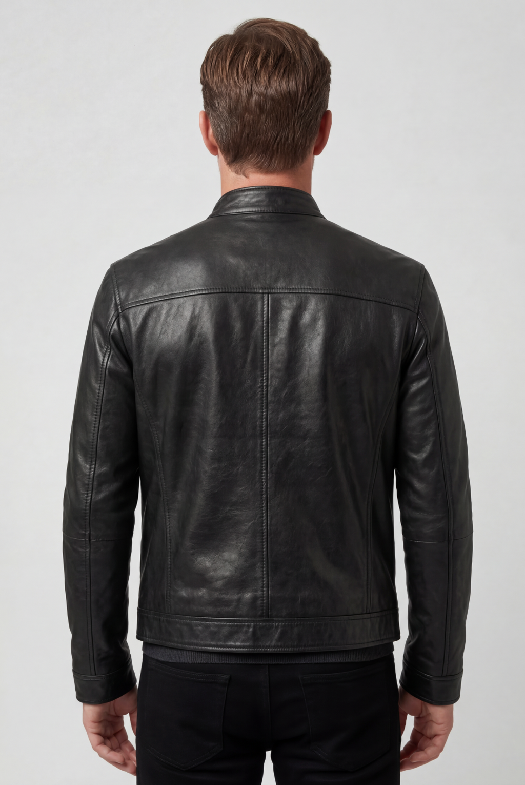 Men's black leather-look jacket with collar, back view showing center seam and ribbed cuffs