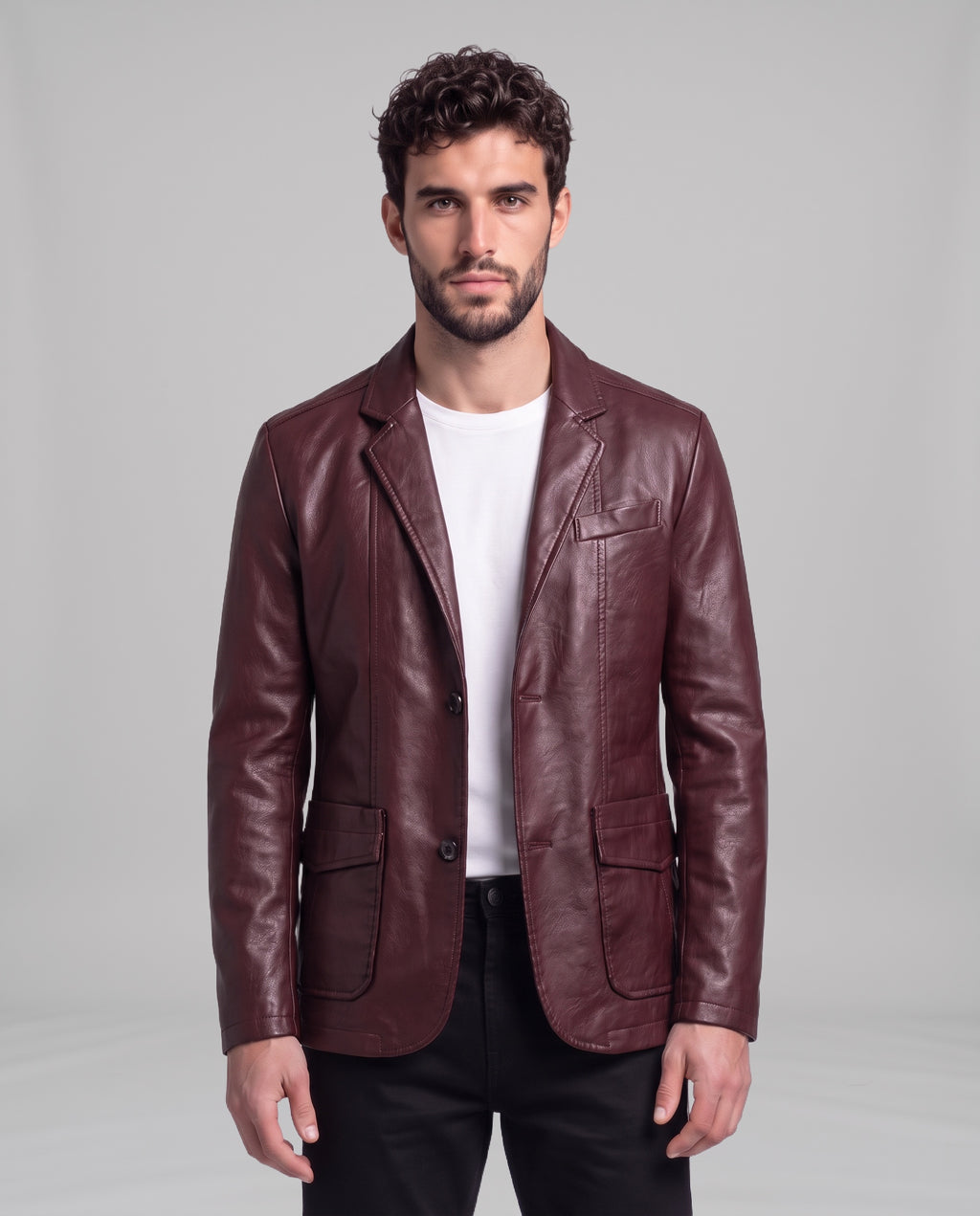 Male model wearing the Soren leather blazer in Burgundy Red over a white t-shirt, front view