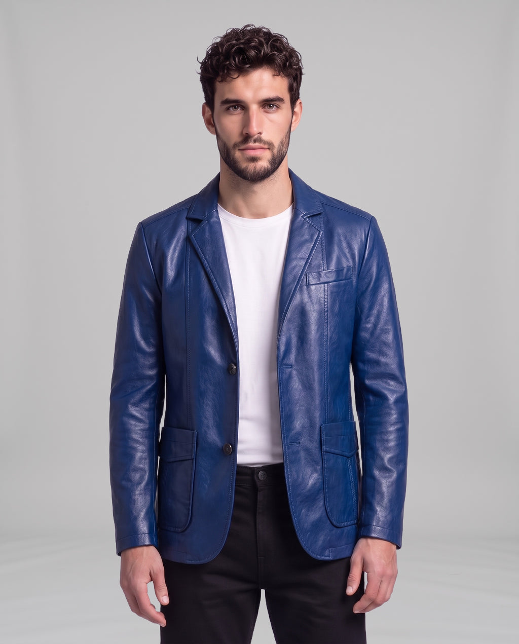 Male model wearing the Soren leather blazer in Sapphire Blue over a white t-shirt, front view