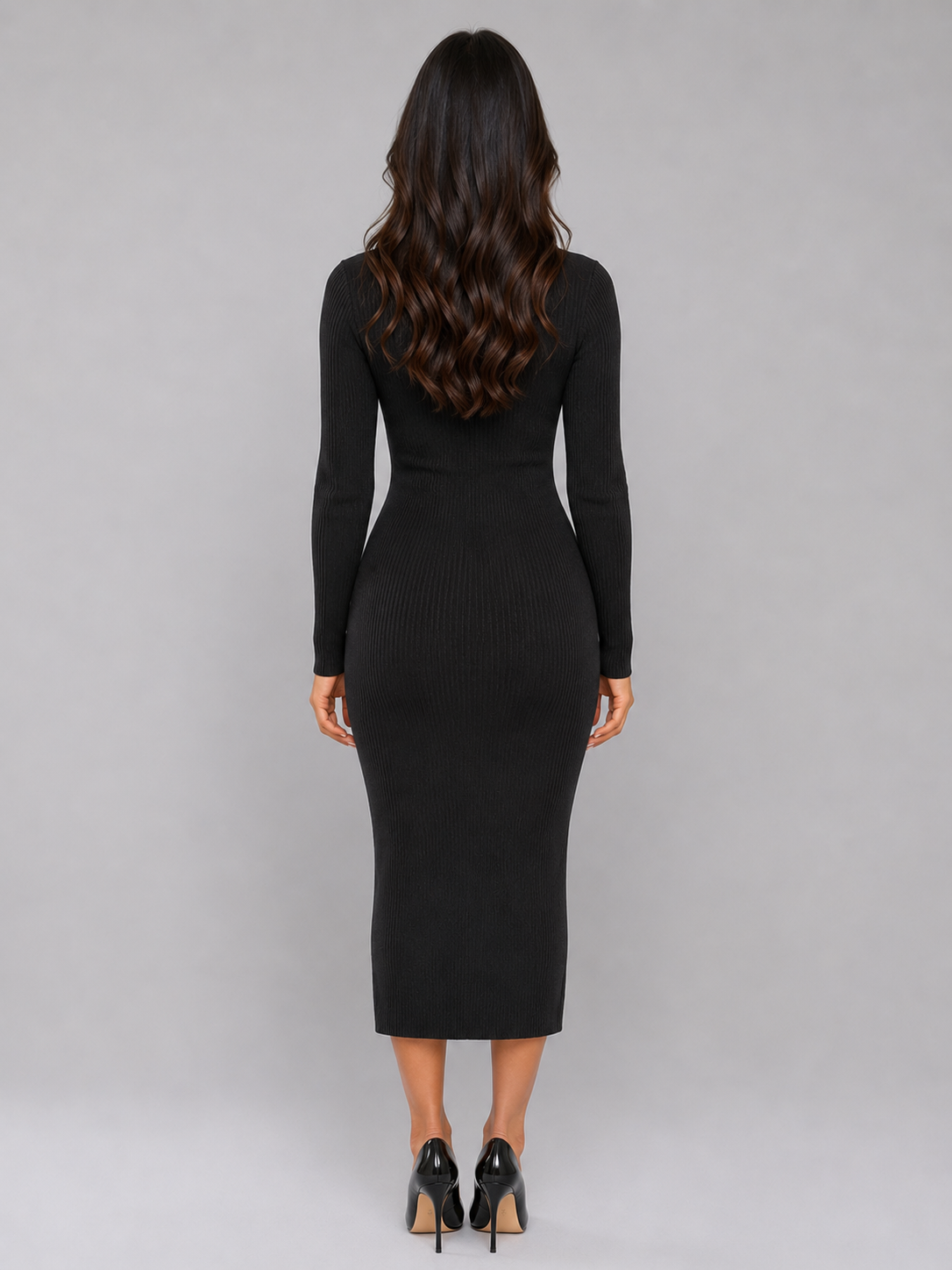 Woman wearing black long-sleeve ribbed knit midi dress with button front, styled with black heeled shoes, shown from back view