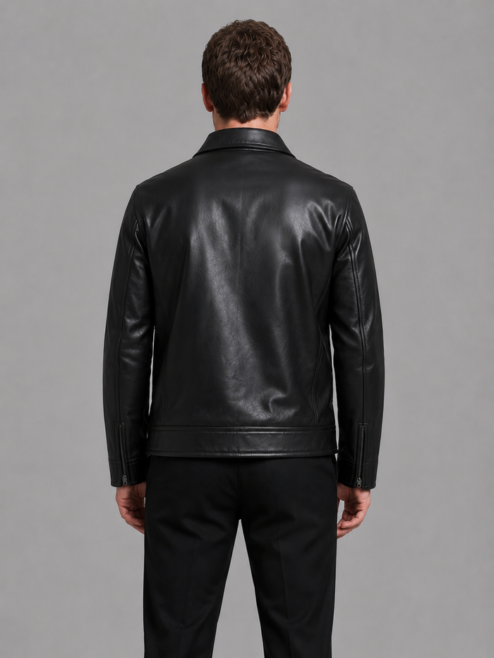 Man wearing black leather jacket with zip pockets and collar, shown from back view against gray background