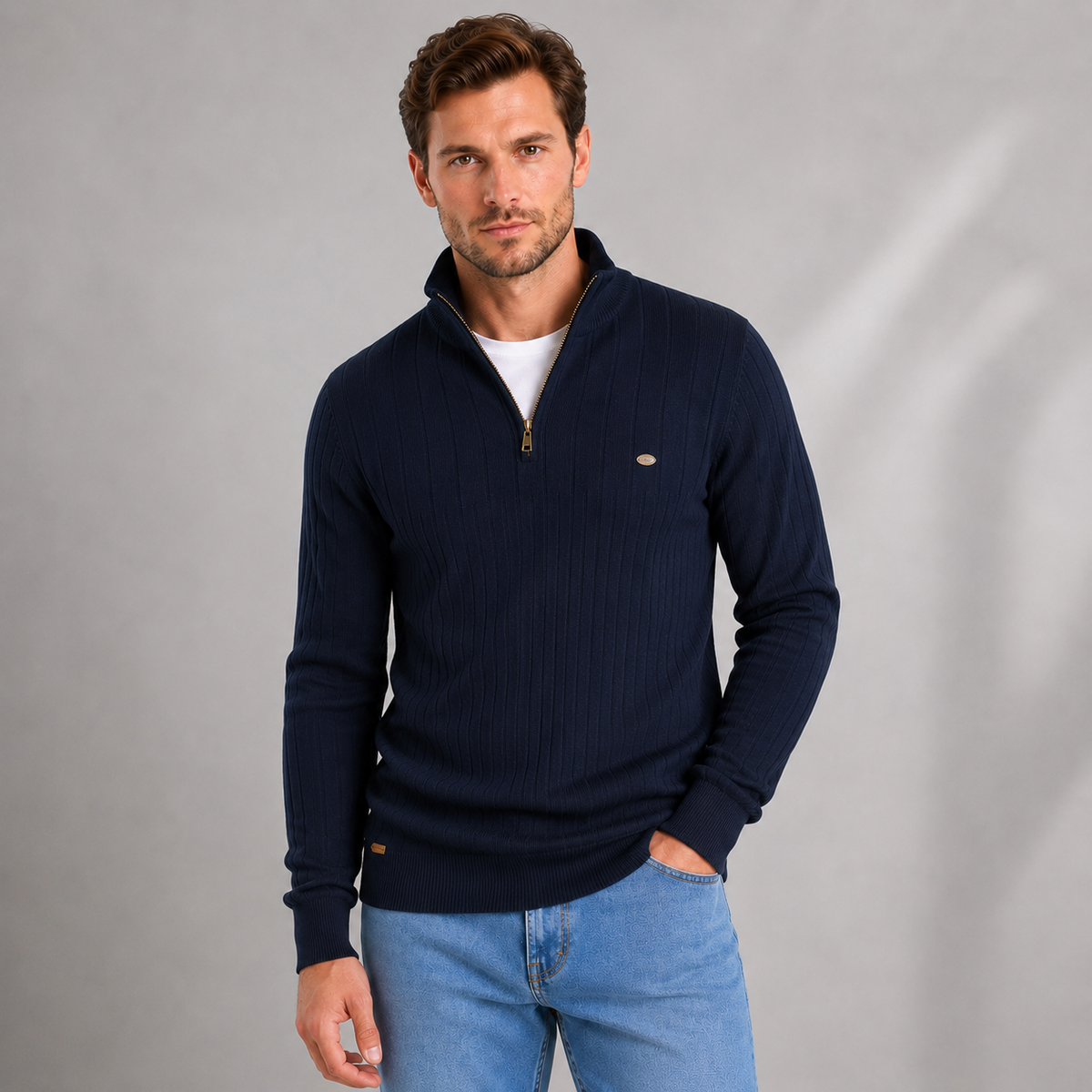 Men's navy ribbed quarter zip funnel neck jumper worn with white t-shirt and light blue jeans