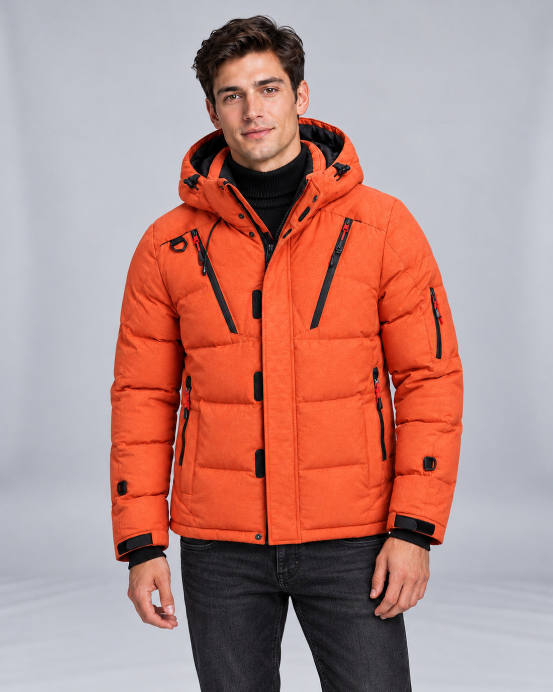 Mountain East Hooded Down Puffer Jacket in Orange — front view, styled with a high-neck knit and denim jeans on Male Model B
