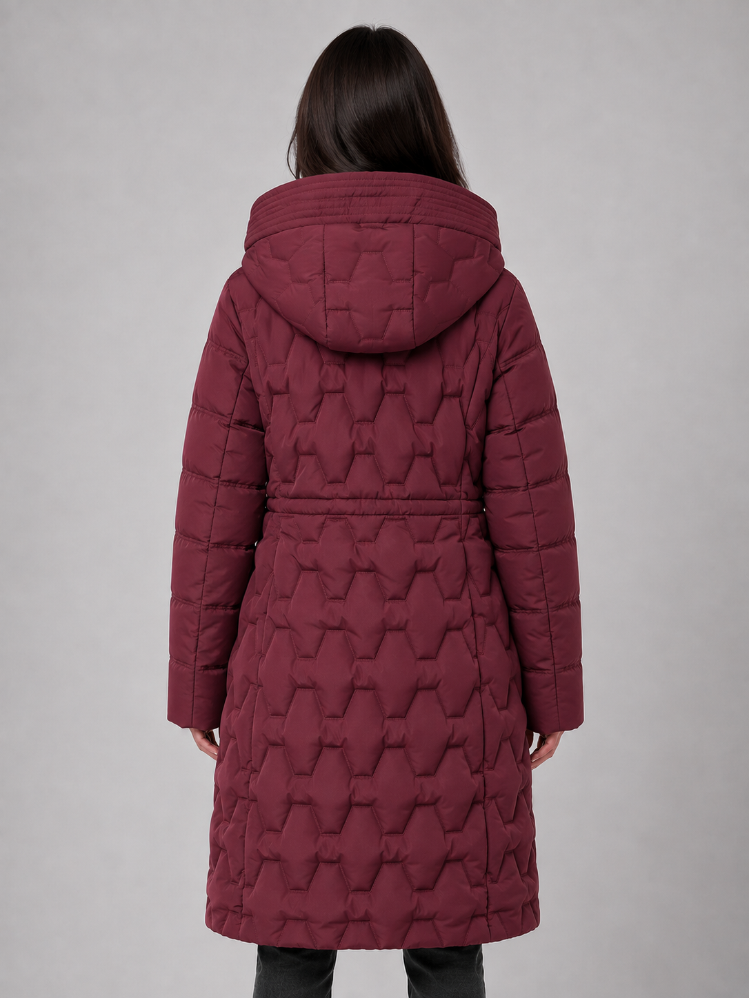 Women's burgundy hooded quilted puffer coat with geometric quilting pattern, shown from back view on gray background