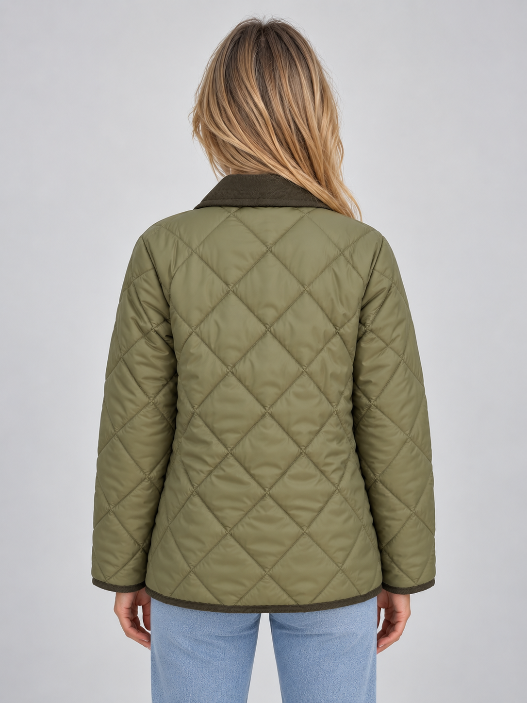 Woman wearing olive green quilted padded coat with corduroy collar and diamond stitch pattern, back view