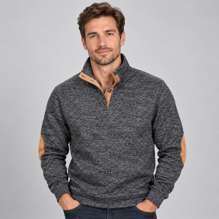 Men's charcoal gray quarter button stand collar jumper with tan suede elbow patches, modeled by man on light gray background