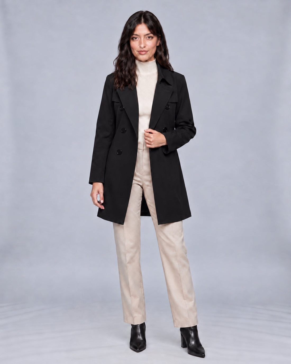 Jasmine wearing black double-breasted trench coat, naturally hand-occluded fastening, Urban Devyne studio