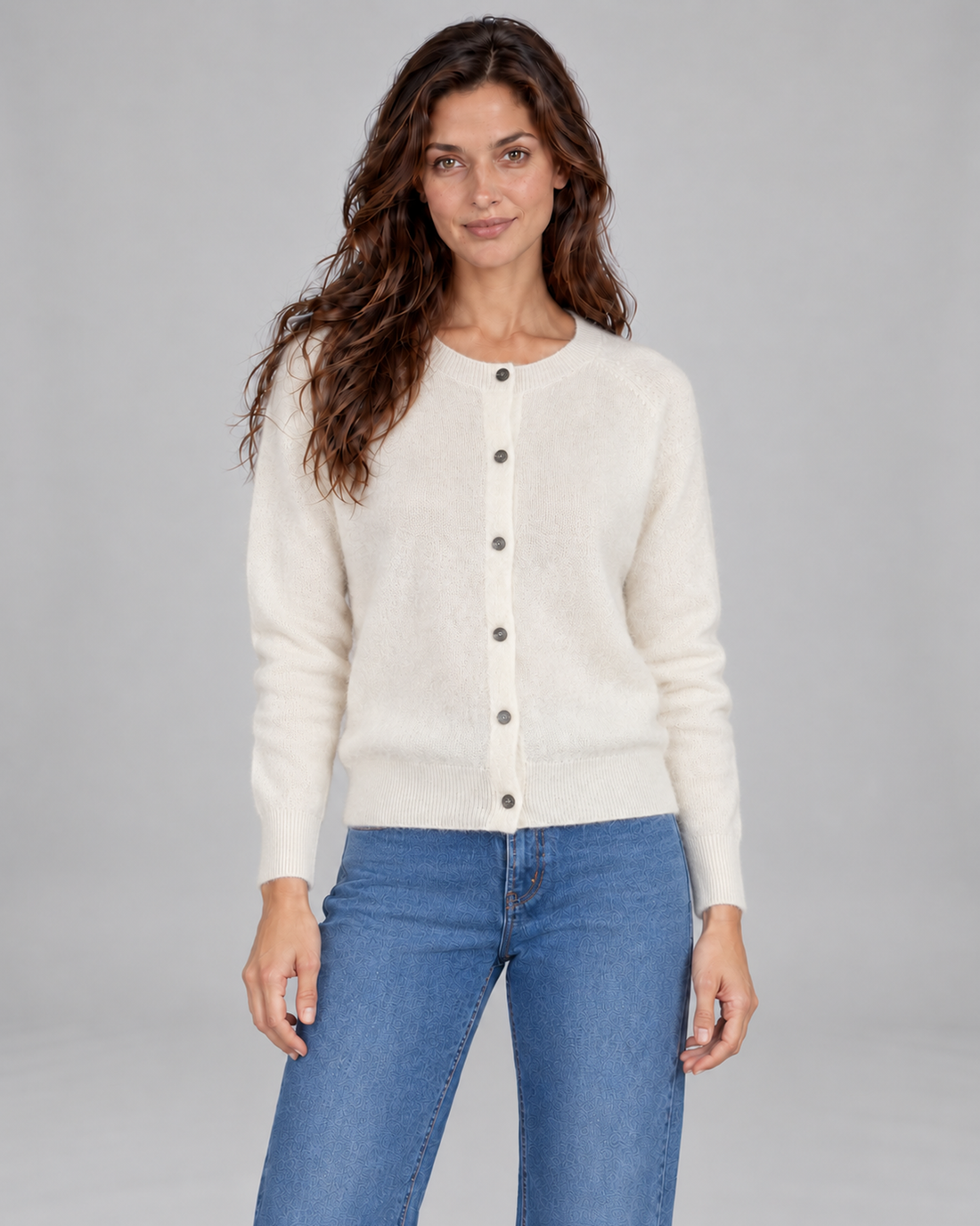 White women's Merino cardigan, front view on Andrea, grey studio