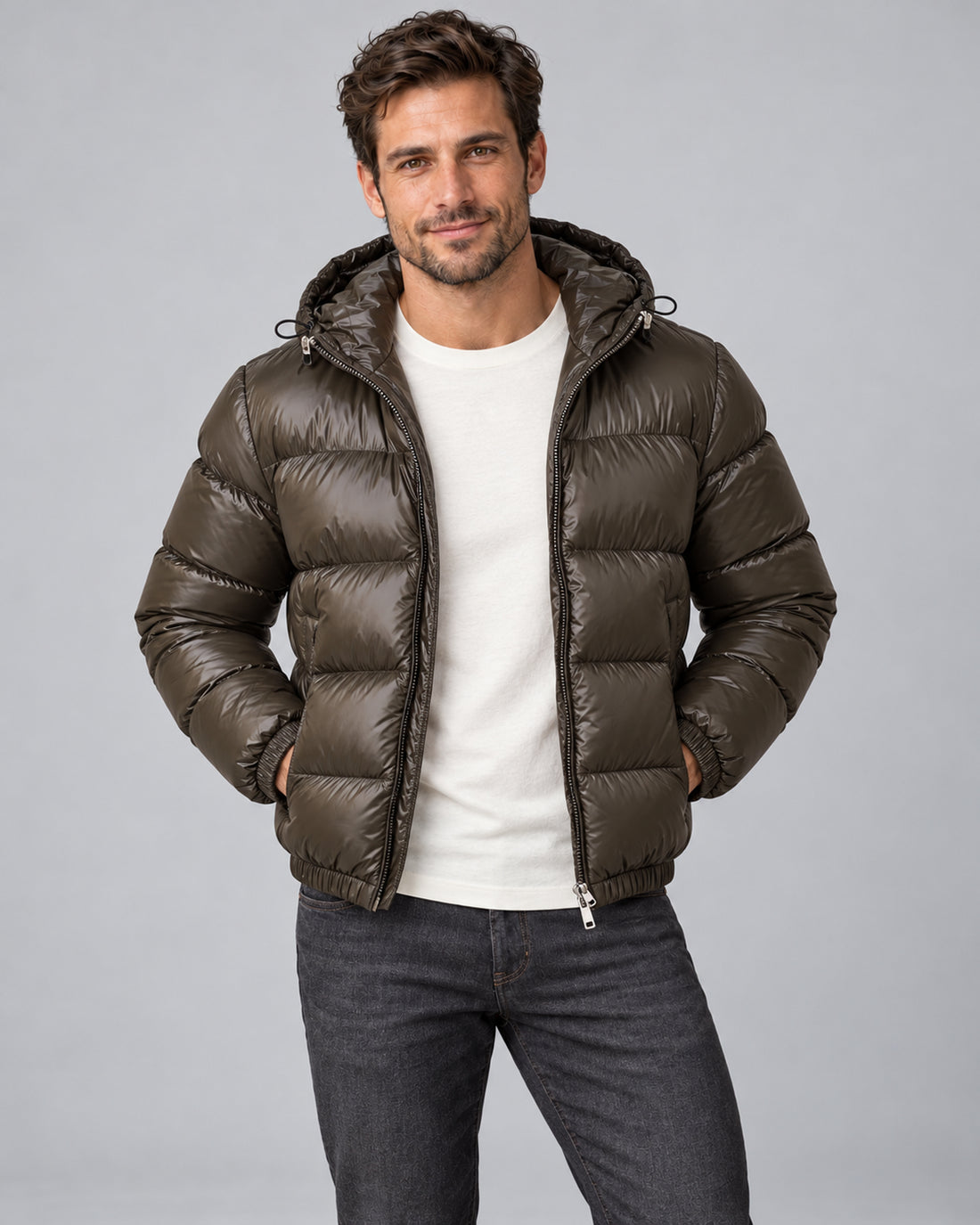 Men's army green hooded quilted puffer jacket open front with both hands in jacket pockets
