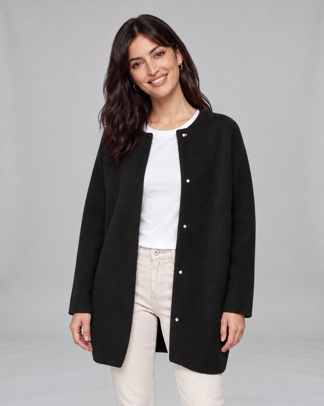 Black women's longline cashmere cardigan, front view on Jasmine, grey studio