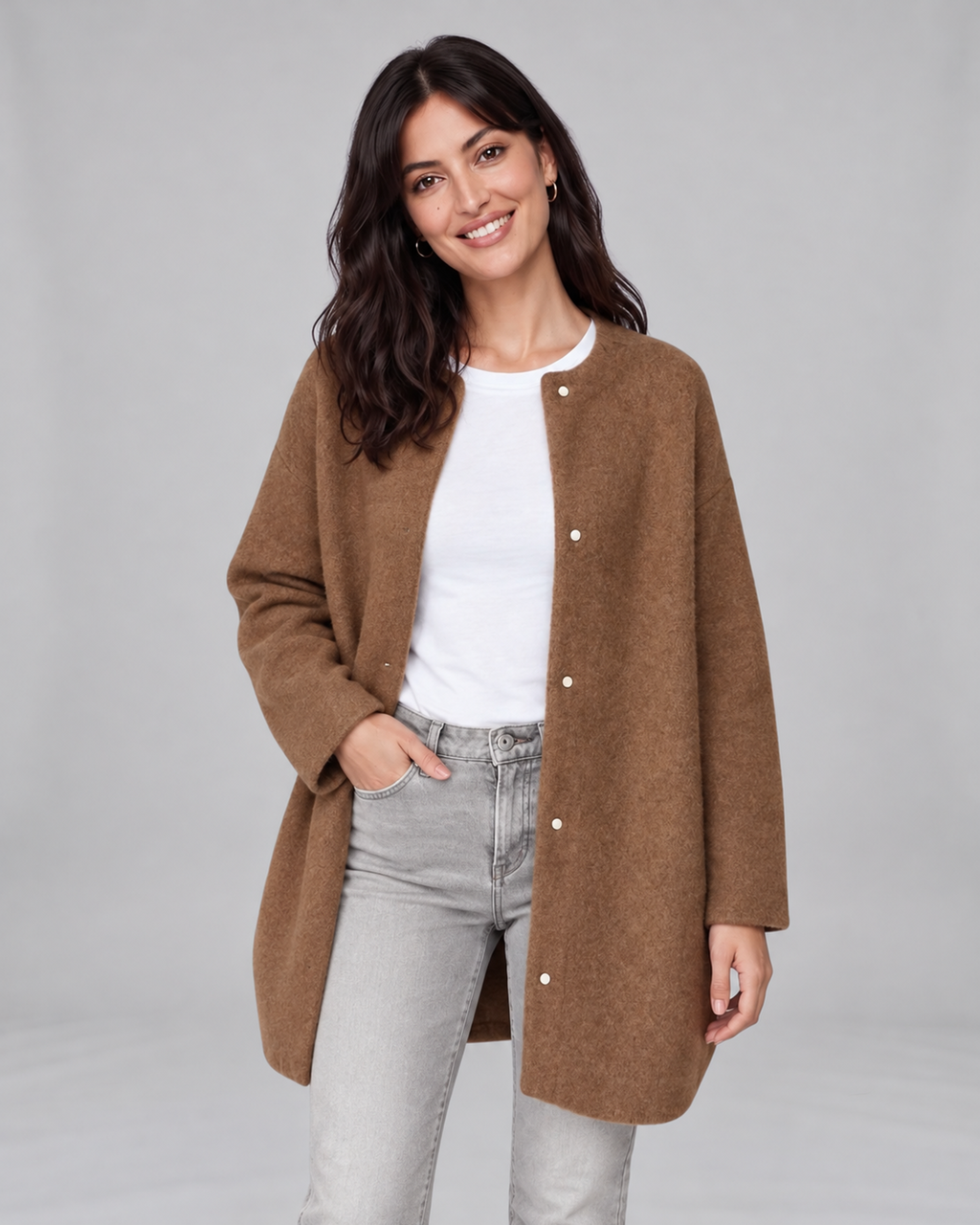 Caramel women's longline cashmere cardigan, front view on Jasmine, grey studio