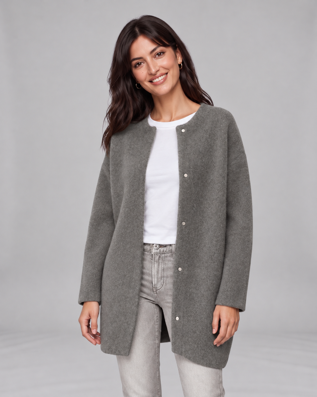 Grey women's longline cashmere cardigan, front view on Jasmine, grey studio