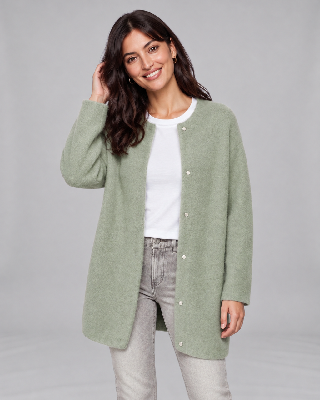 Green women's longline cashmere cardigan, front view on Jasmine, grey studio