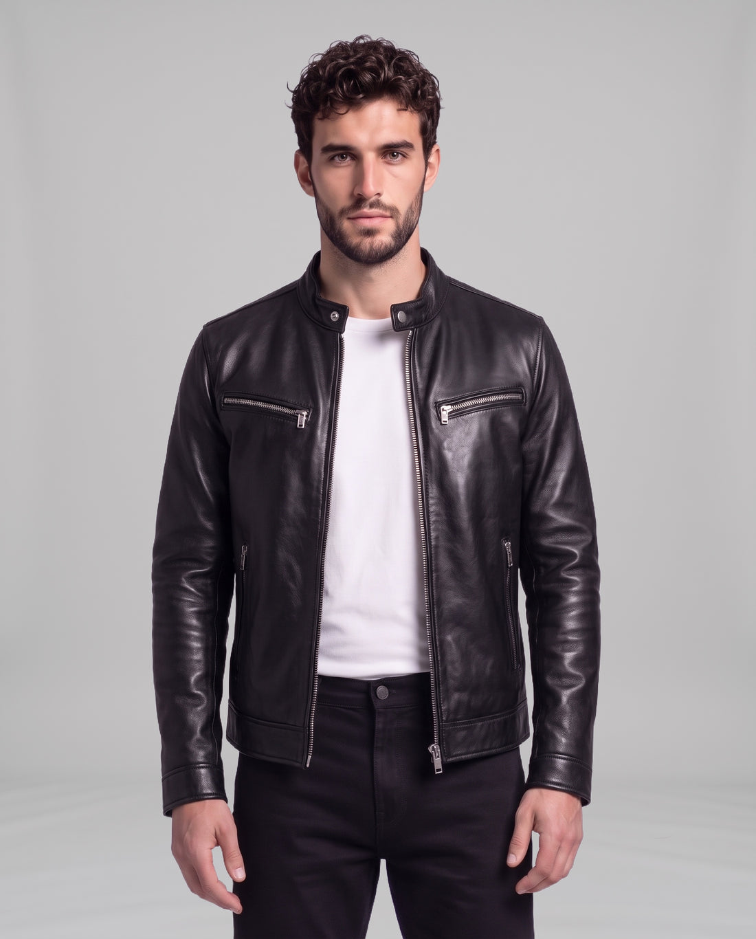 Male model wearing the Garrett vintage leather cafe-racer jacket in Biker Black over a white t-shirt, front view