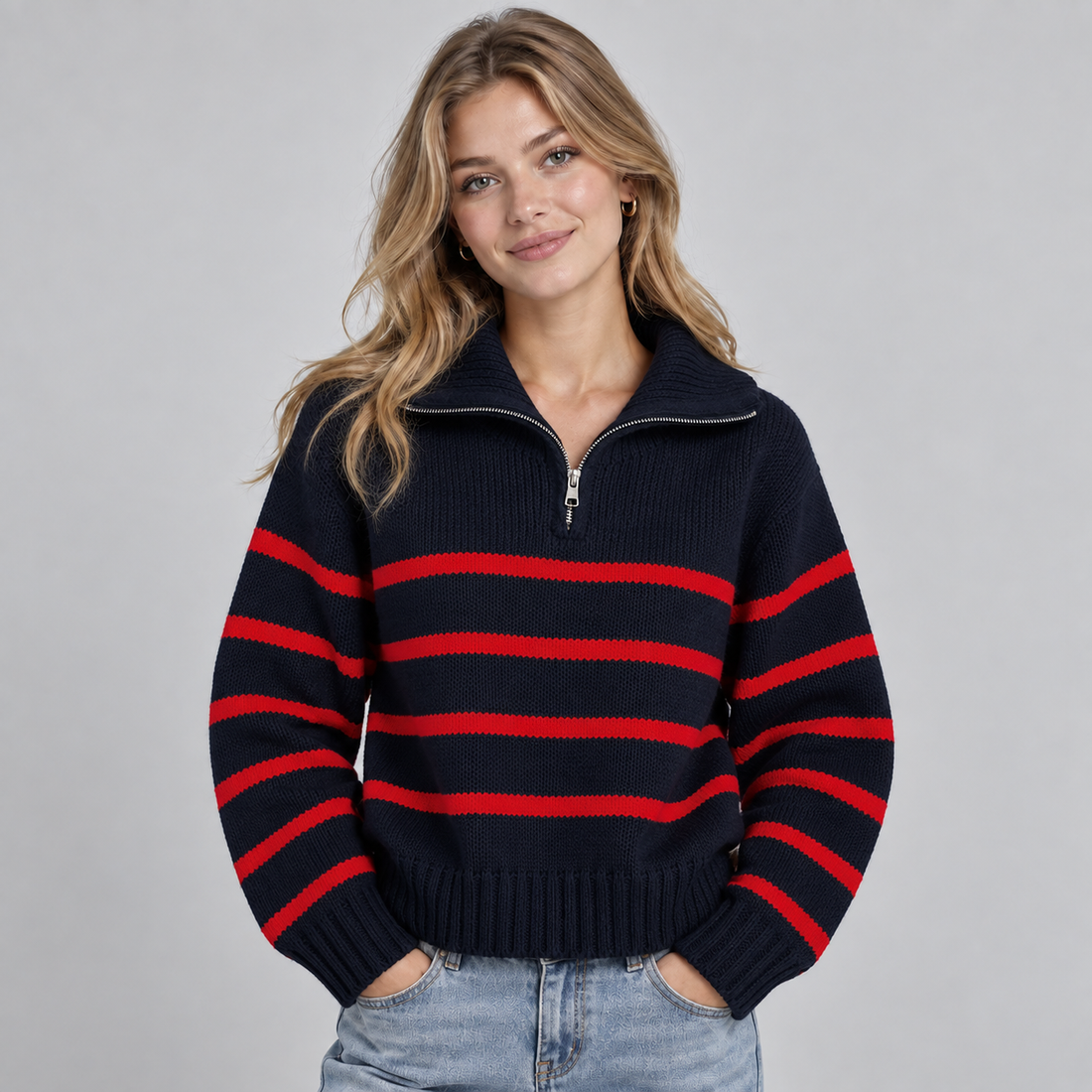 Women's navy and red striped half zip funnel neck jumper worn with light blue jeans
