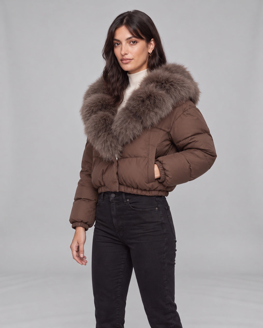 Women’s brown cropped puffer jacket with fox fur-lined hood — left pocket view on Jasmine