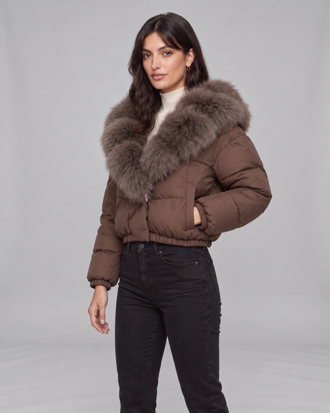 Women’s brown cropped puffer jacket with fox fur-lined hood — left pocket view on Jasmine