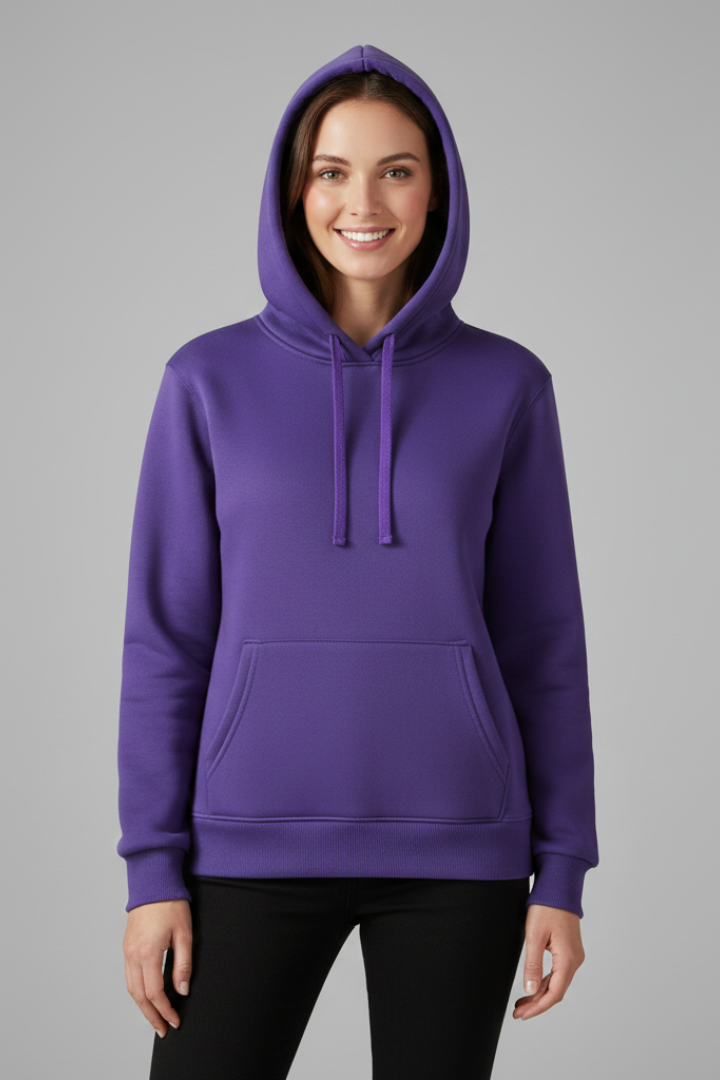 Woman wearing purple hoodie with adjustable drawstring hood, front kangaroo pocket, and ribbed hem, styled with black pants